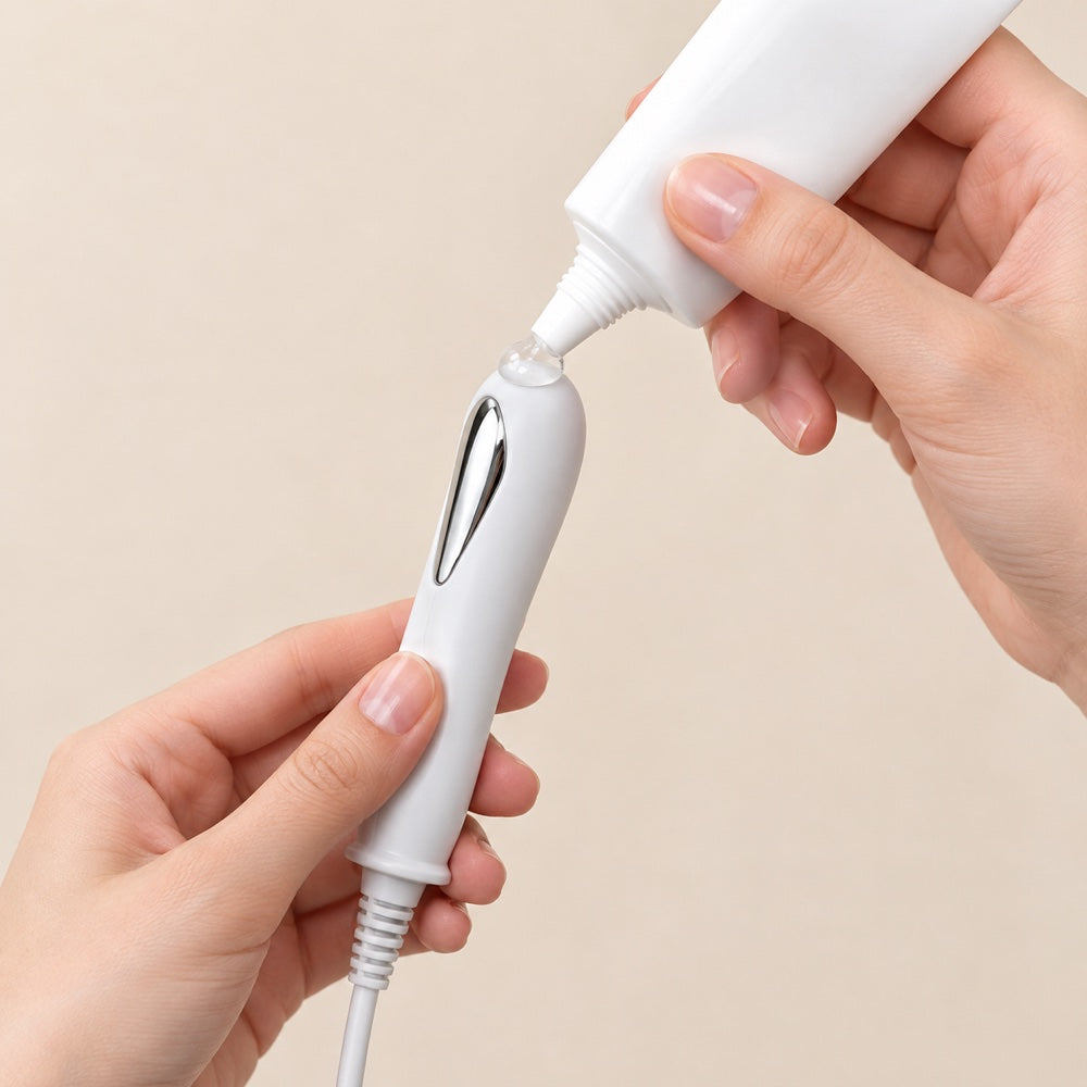 Applying a drop of water-based gel to the probe tip
